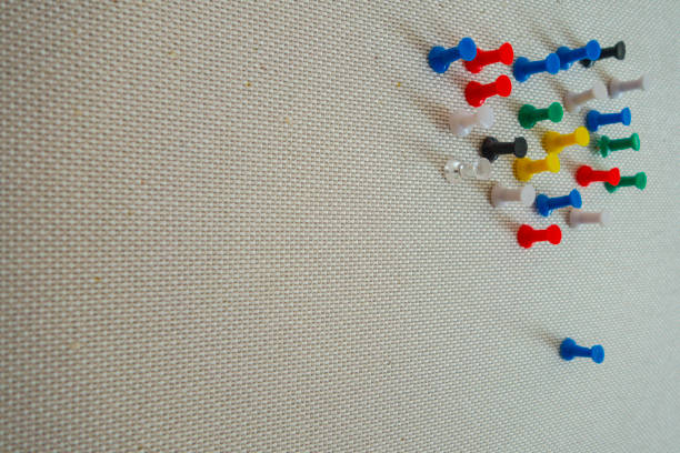 istock office colorful thumbtacks pushpins on a pining white tan wall 1155974843