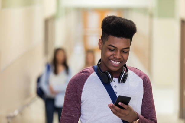 istock University student checks class status on smart phone 1155974951