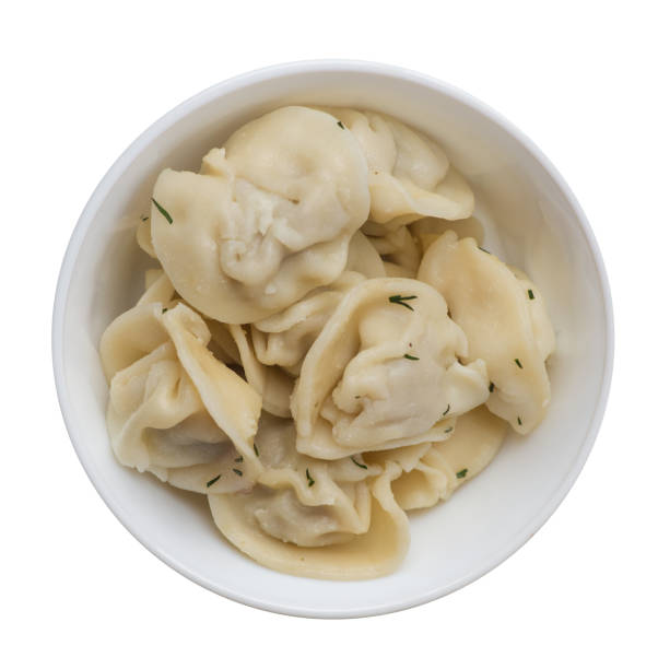 istock dumplings on a plate isolated on white background .meat dumplings top view . 1155975689