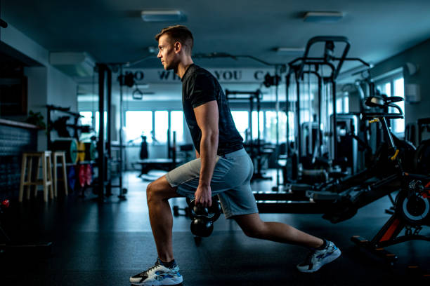 istock Athletic Young Adult Doing Lunges 1155977520
