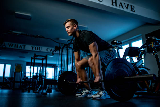 istock Dedicated Young Mid Adult Deadlifting 1155977526