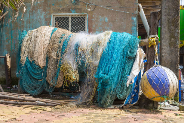 istock Blue and white fishing nets hanging to dry 1155978439