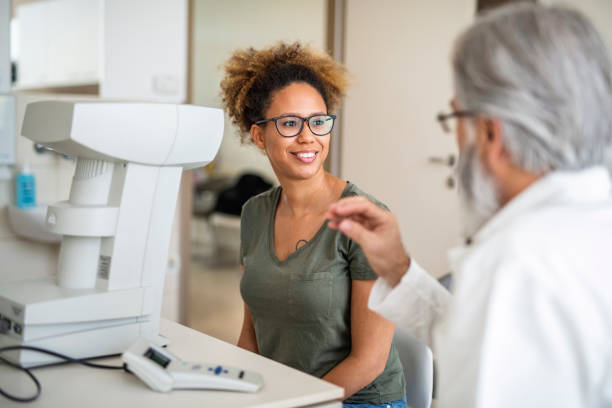 istock Woman testing out her new eyeglasses in ophthalmology office 1155980513