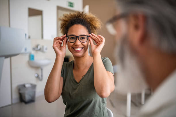 istock Woman testing out her new eyeglasses in ophthalmology office 1155980554