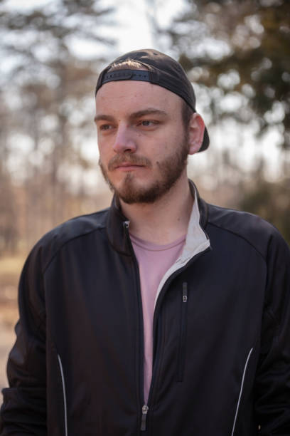 istock one young man, portrait outdoors, upper body. 1155981835