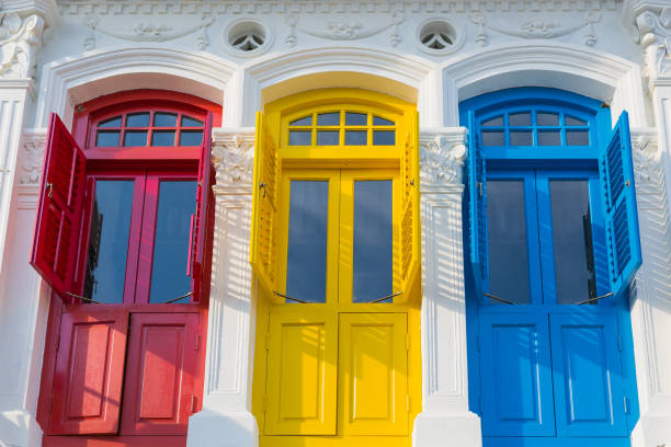 istock Colonial style three colorored doors with ornaments 1155981912