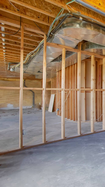 istock Vertical frame House interior under construction with air conditioning ducts on the ceiling 1155982700