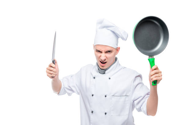 istock angry mad cook with knife and griddle on white background 1155984893