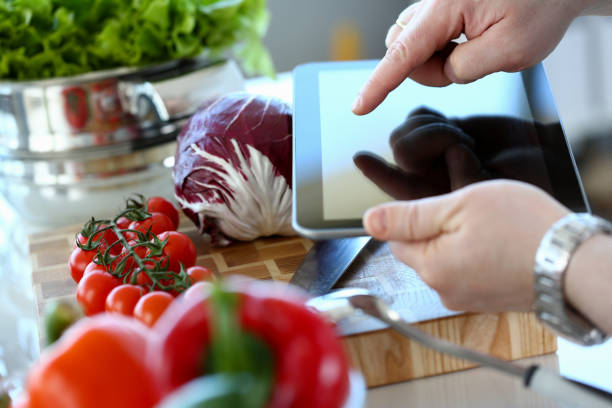 istock Man Vlogger Pointing Vegan Vegetables Salad Recipe 1155986621