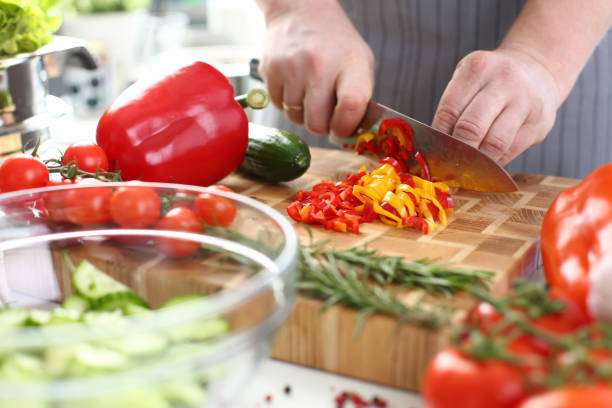 istock Chef Cutting Organic Vegetable Salad Ingredients 1155986635