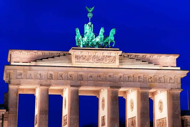 Photo of Brandenburg gate on Parizer Platz Street night Berlin