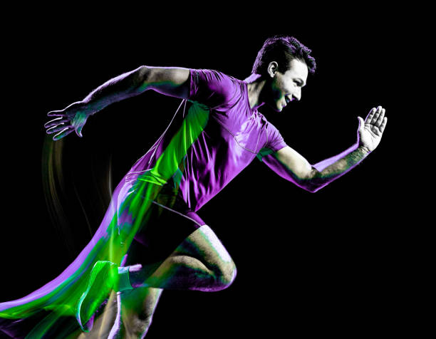 istock runner running jogger jogging man isolated light painting black background 1155999578