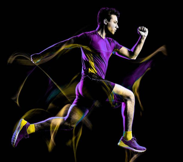 istock runner running jogger jogging man isolated light painting black background 1155999605