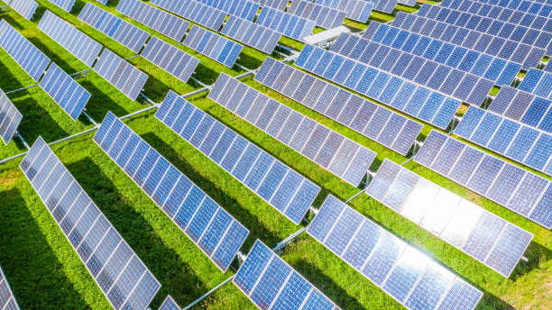 solar panels in aerial view, renewable energy with photovoltaic panels. - solar panel fotos imagens e fotografias de stock