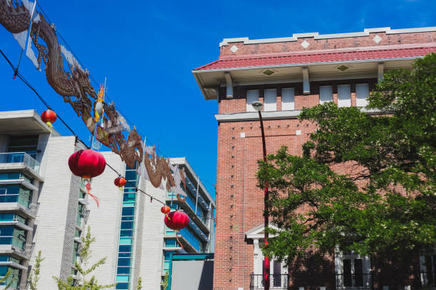 Victoria, Canada - June 11, 2019. A Chinatown decoration seperates two buildings on the outskirts of Chinatown.