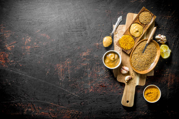 istock Assortment of different types of mustard with lemon on a cutting Board. 1156008609