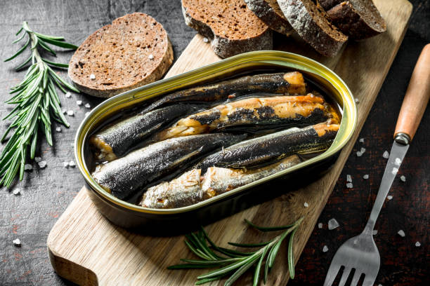 istock Sprats with rosemary and sliced bread. 1156010710