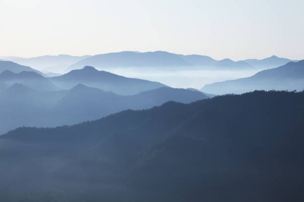 sea of clouds foggy morning mountains sea of clouds foggy morning mountains okayama prefecture stock pictures, royalty-free photos & images
