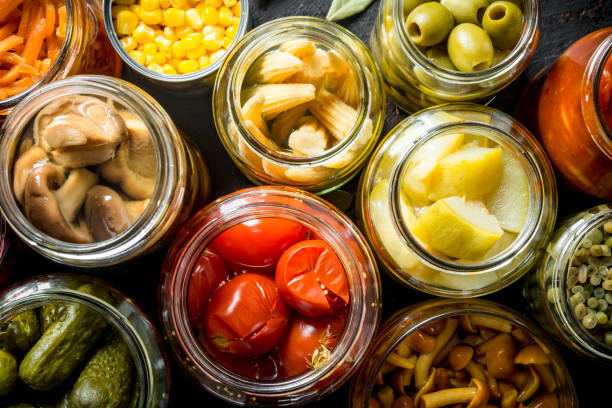 istock Preserved vegetables in glass jars. 1156010825