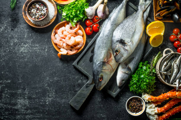 istock Fresh fish with shrimp, crab and herbs. 1156010876