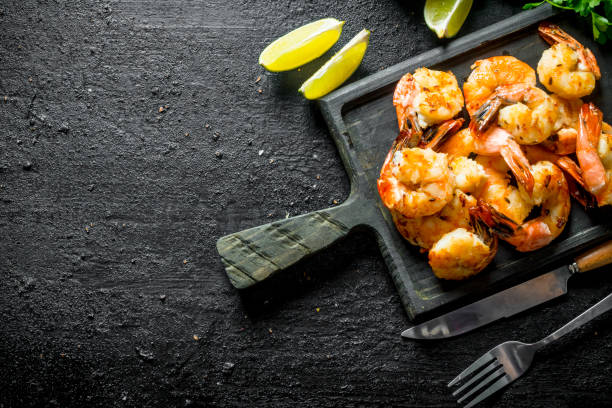 istock Delicious shrimps on the cutting Board. 1156016960