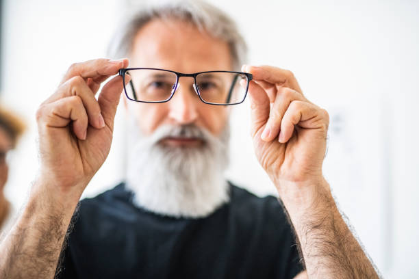 istock Man testing out his new eyeglasses in ophthalmology office 1156020590