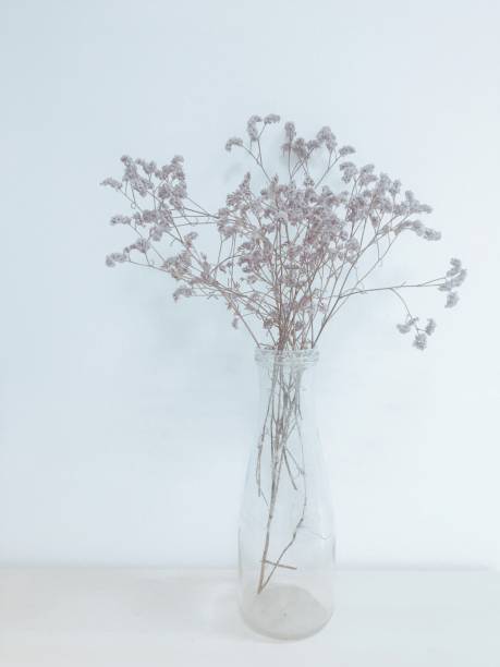 istock Bridal flowers dried in vase on table top 1156022197