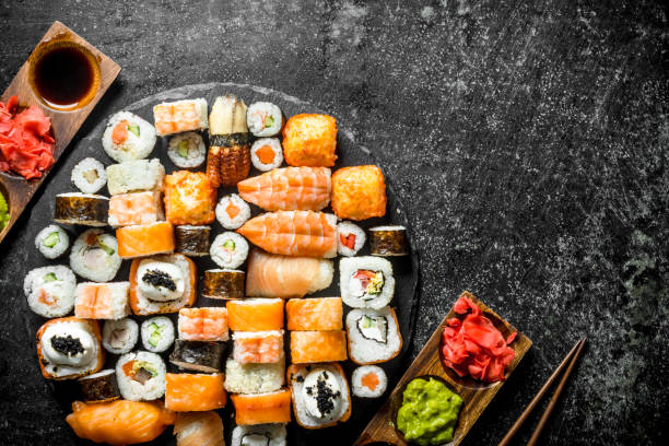 istock Delicious Japanese rolls with sauce and chopsticks. 1156022406