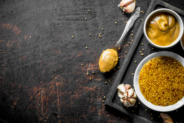 istock Different kinds of mustard on the cutting Board. 1156024269