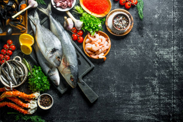 istock Fresh fish with shrimp, crab and herbs. 1156024297
