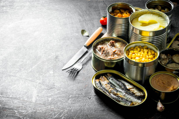 istock Group of open tin cans with canned food. 1156025181