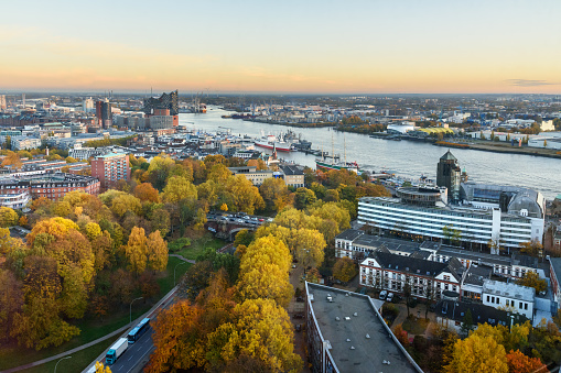View of Hamburg with Michel, harbor, and New Elbphilharmony on sunset. Germany
