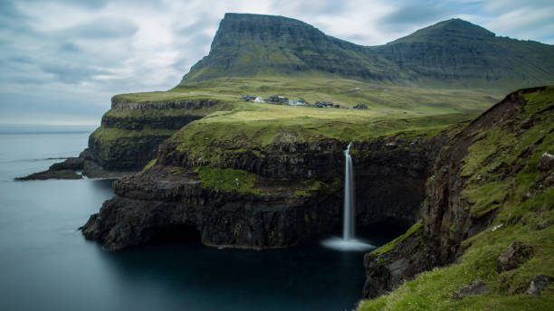 istock Faroe Islands waterfall Gasaladur 1156029083