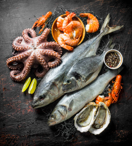 istock Fresh seafood with spices and lime slices. 1156029289