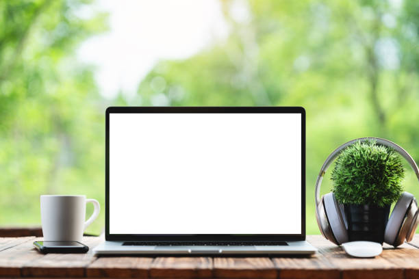 istock laptop computer showing white frame morning nature background 1156030854