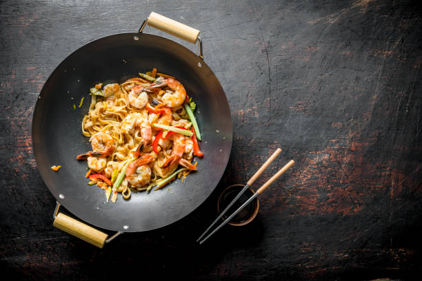 istock Freshly cooked Asian Udon noodles with vegetables and shrimp. 1156030918