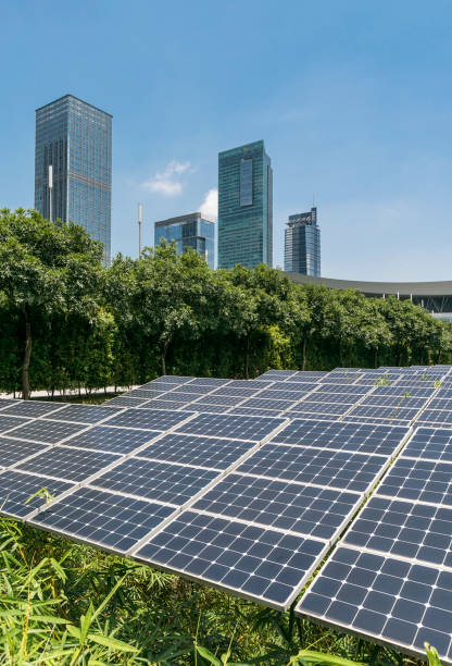 istock solar panel plant with urban landscape landmarks,Ecological energy renewable concept 1156032181