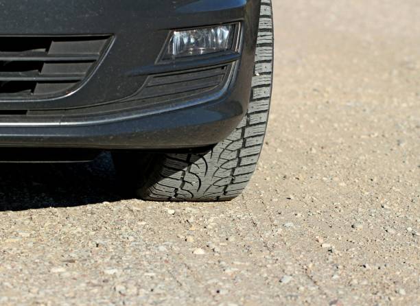 istock Car on gravel road. 1156032561