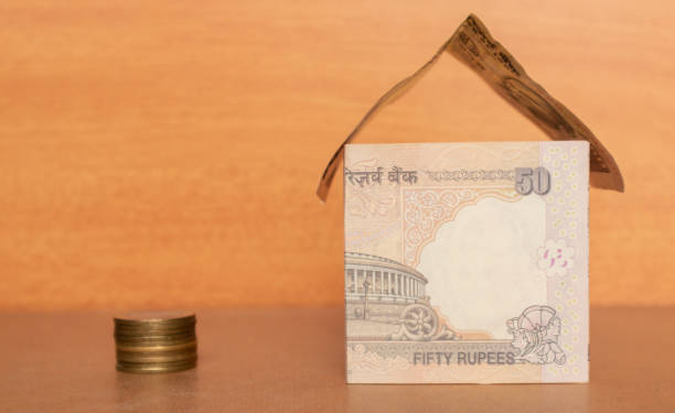 House made from the Indian currency with Coins.