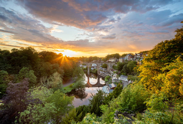 Classic summer sunset view of the railway viaduct over the river Nidd valley in the market town of Knaresborough in North Yorkshire England Classic summer sunset view of the railway viaduct over the river Nidd valley in the market town of Knaresborough in North Yorkshire England north yorkshire photos stock pictures, royalty-free photos & images