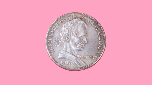 istock half dollar coin isolated on pink background 1156039428
