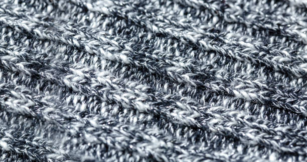 istock Black and white threads wool texture made of cotton or wool. closeup. 1156040383