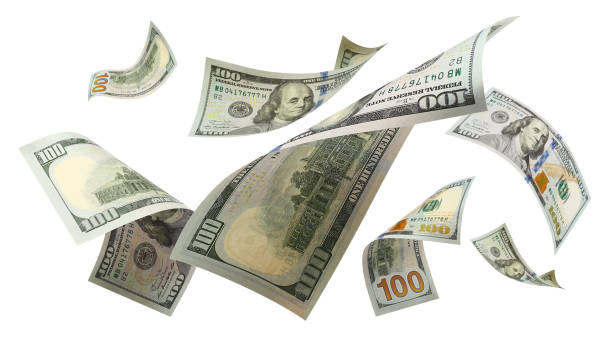 istock Flying 100 American dollars banknotes on white 1156041484