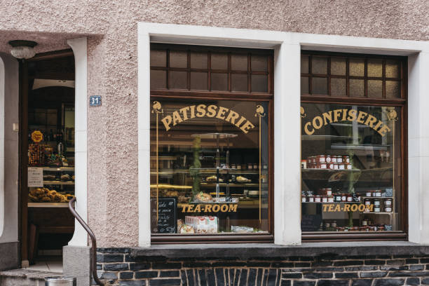 Exterior of patisserie shop and tea rooms in Vianden, Luxembourg. Vianden, Luxembourg - May 18, 2019: Exterior of patisserie shop and tea rooms in Vianden, town in Luxembourgs Ardennes region known for the centuries-old hilltop Vianden Castle. vianden stock pictures, royalty-free photos & images