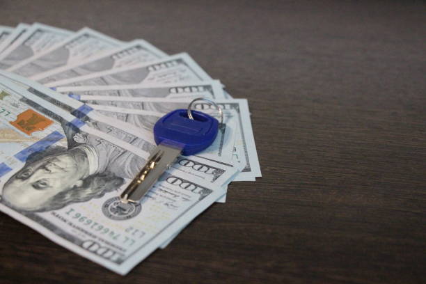istock The key lies on the hundred-dollar bills. 1156043813