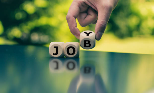 istock Concept for fun at work. Hand turns a cube and changes the word 