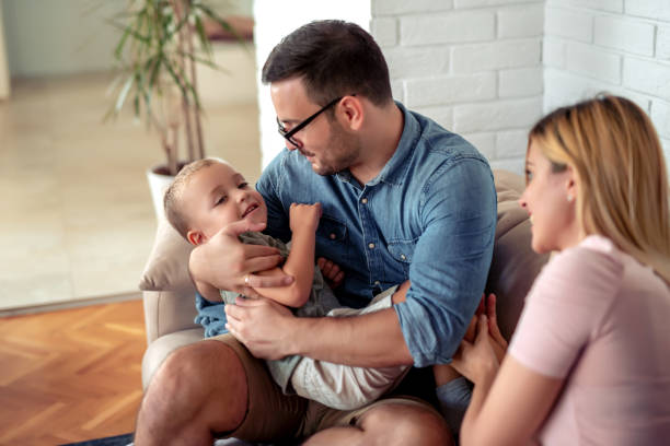 istock Happy family laughing together 1156044594