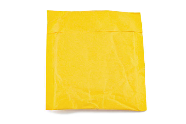 istock yellow postal bag for packing parcels. Isolated on white background. 1156059036