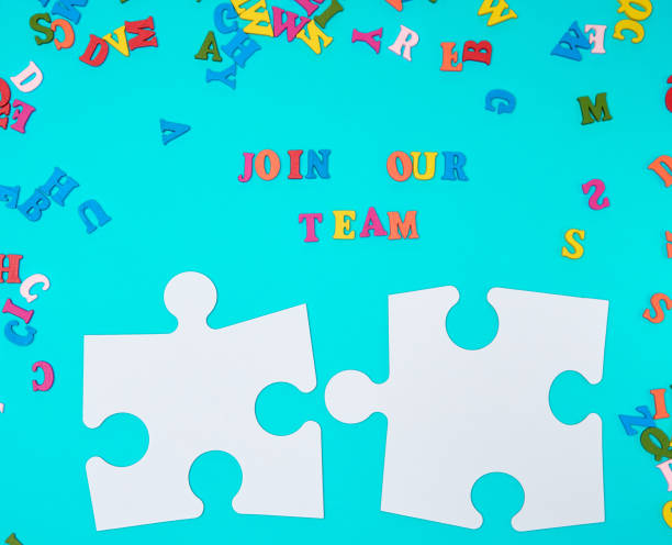 istock paper blank white puzzle on a blue background,  inscription join our team 1156060024