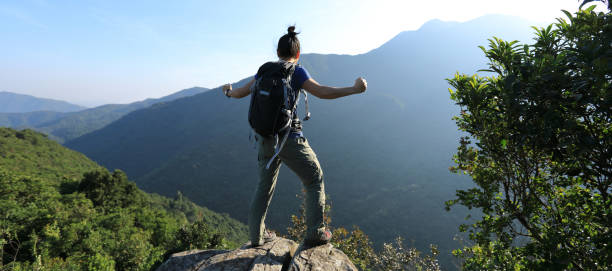 istock Fearless hiker feel strong on summer sunrise mountain top cliff edge 1156061194